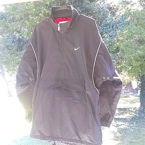 Nike athletic pull over zippered lined windbreaker.